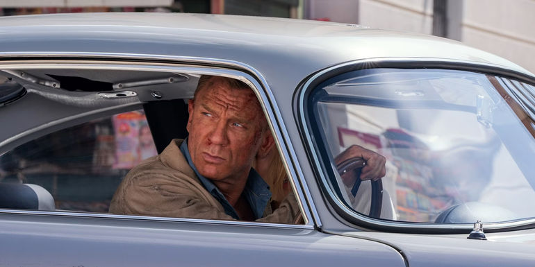 James Bond looking out the window of his car in No Time to Die