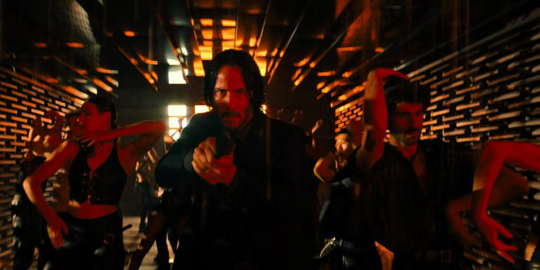 John Wick with a gun in the The Club Himmel und Hölle