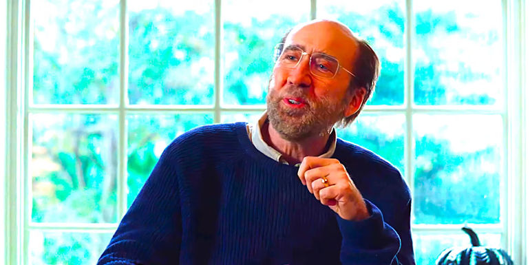 Nicolas Cage smiles while conversing in Dream Scenario