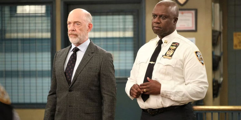 An image of JK Simmons standing next to Andre Braugher in Brooklyn Nine-Nine
