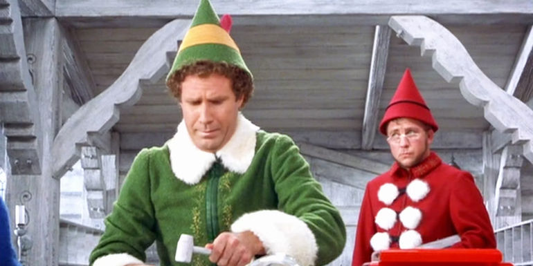 Ming Ming standing behind Buddy in Elf