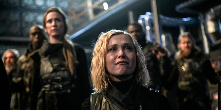 Clarke and her friendslook upset in a warehouse in The 100
