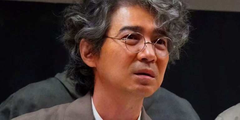 Hidetaka Yoshioka as Kenji Noda Looking Grave in Godzilla Minus One