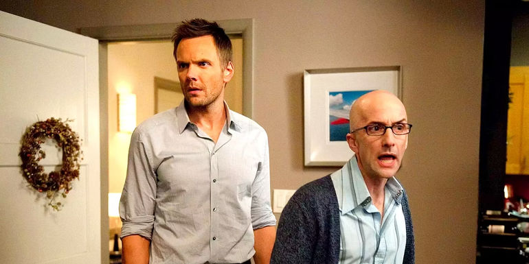Joel McHale as Jeff and Jim Rash as Dean Pelton look concerned on Community.