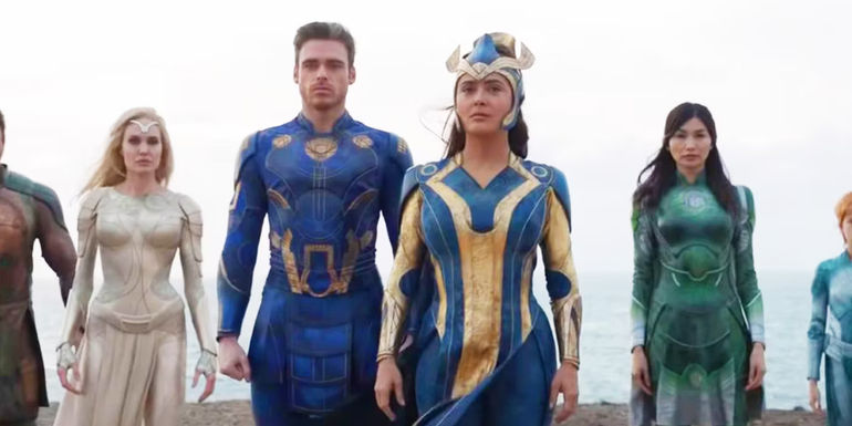 Members of the Eternals stand together on a shoreline