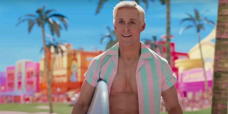 Ken (Ryan Gosling) wearing a green and pink striped open-buttoned shirt and holding a surf board in the Barbie movie.