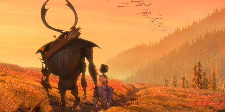 Kubo riding on Monkey's back with Beetle following in Kubo and the Two Strings
