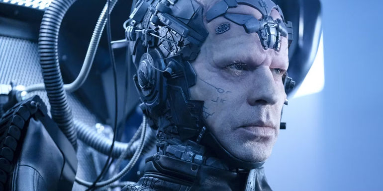 Close-up shot of The Thinker sitting in his chair in The Flash