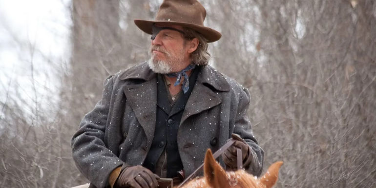Jeff Bridges as Deputy U.S. Marshal Rooster Cogburn on horseback in True Grit