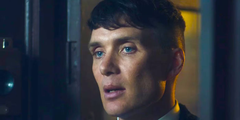 Cilian Murphy as Tommy Shelby informing someone of something in Peaky Blinders season 4.