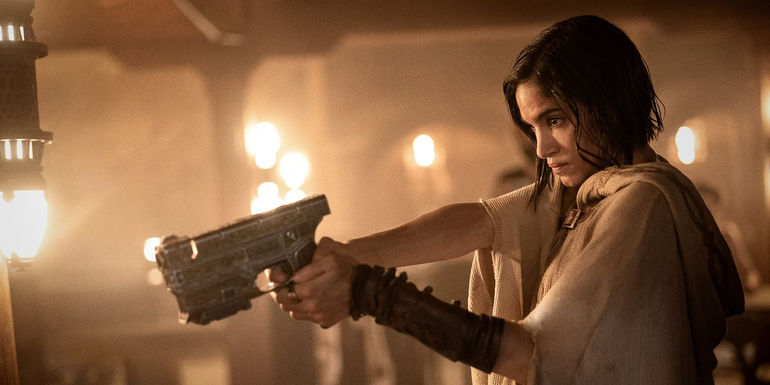 Sofia Boutella as Kora pointing a gun in Rebel Moon