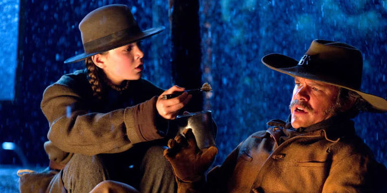 Mattie Ross (Hailee Steinfeld) and LaBoeuf (Matt Damon) argue in True Grit