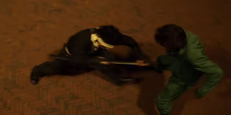 Hiei attacks Yusuke using a sword in Yu Yu Hakusho episode 3