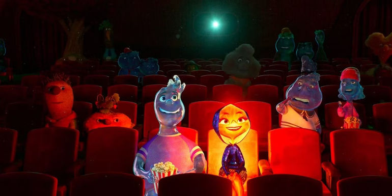 Ember Lumen and Wade Ripple sitting in a theater from a scene in Elemental