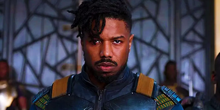 Michael B. Jordan as Killmonger scowls while apprehended in Black Panther.