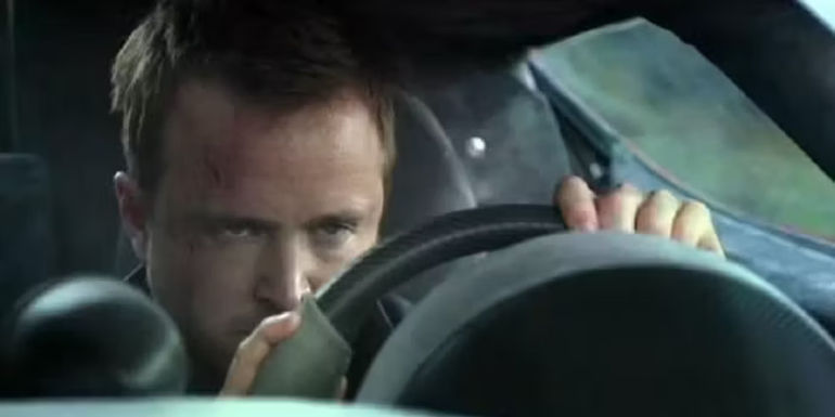 Aaron Paul driving and looking angry in Need for Speed