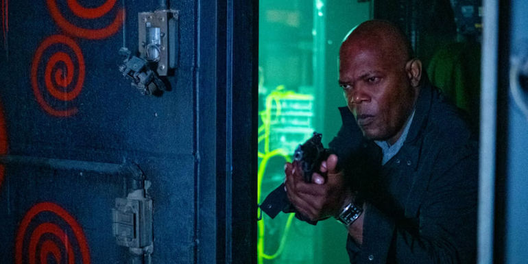 Samuel L. Jackson as Marcus investigating crime scene in Spiral: From the Book of Saw