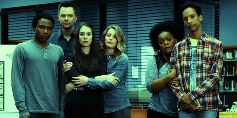 Troy, Jeff, Annie, Britta, Shirley, and Abed all hold each other while standing in the study room in Community.