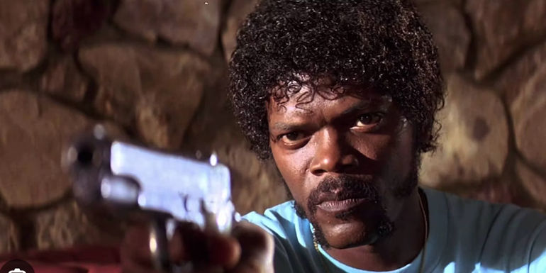 Samuel L Jackson points a gun in Pulp Fiction