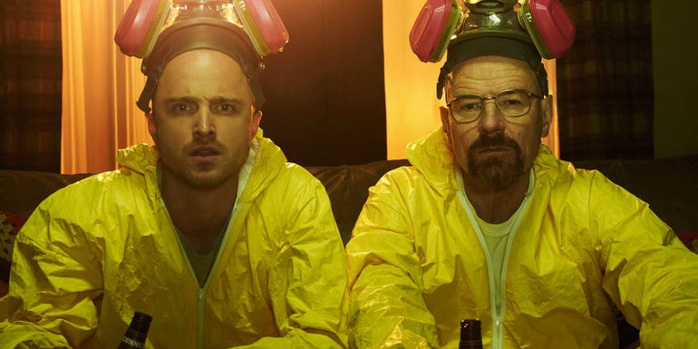 Walt and Jesse in hazmat suits sitting on a couch in Breaking Bad Poster