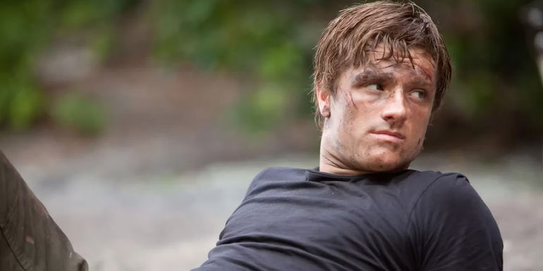 Peeta, dirty and leaning back in the Hunger Games