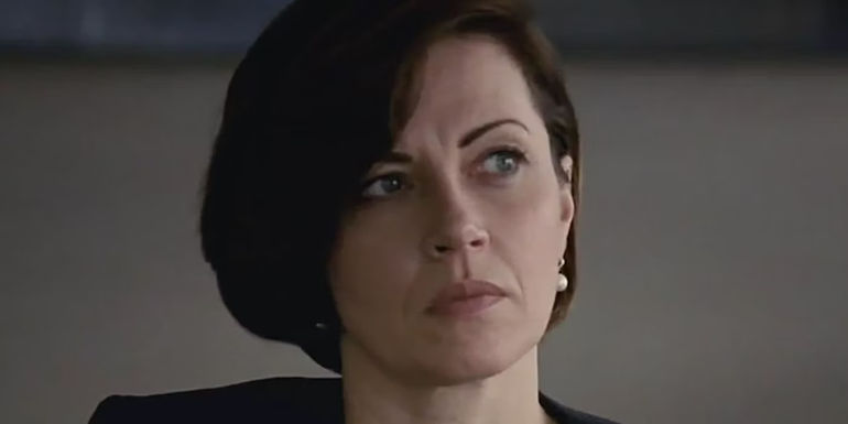 A close up of Karolina (Dagmara Domincyzk) from Succession, hair swept to the side with a serious look on her face.