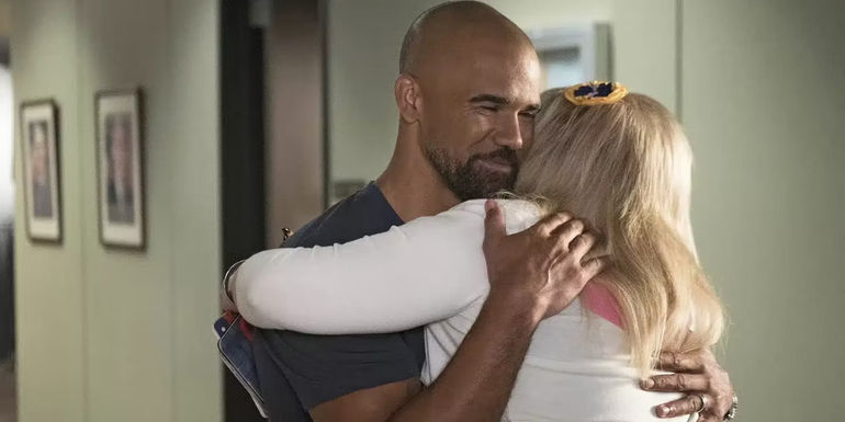 Derek Morgan and Penelope Garcia hugging on Criminal Minds