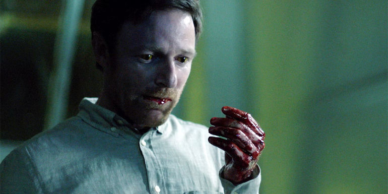 Reynard The Fox holds up his hand covered in his victim's blood.