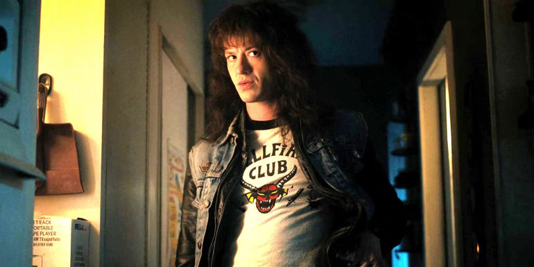 Joseph Quinn as Eddie Munson looking at something in Stranger Things season 4