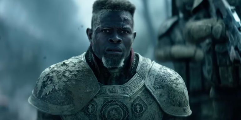 Djimon Hounsou as General Titus wearing armor and looking worried in Rebel Moon