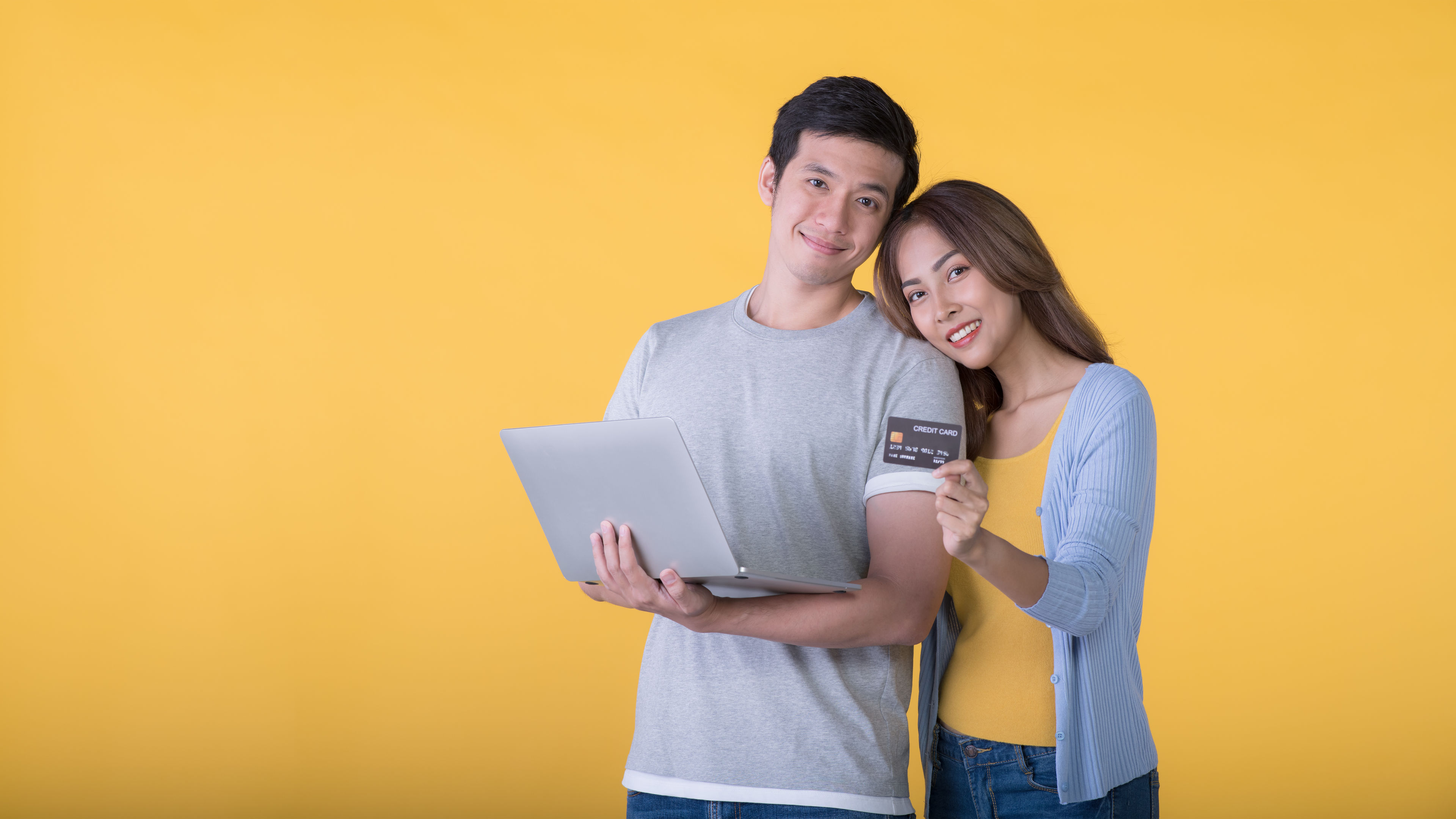 Couple with laptop and card 