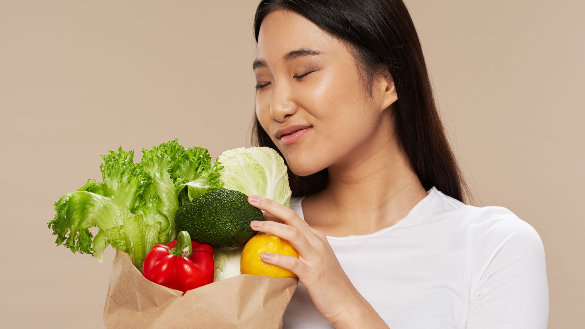 Women showing Vegetables organic food