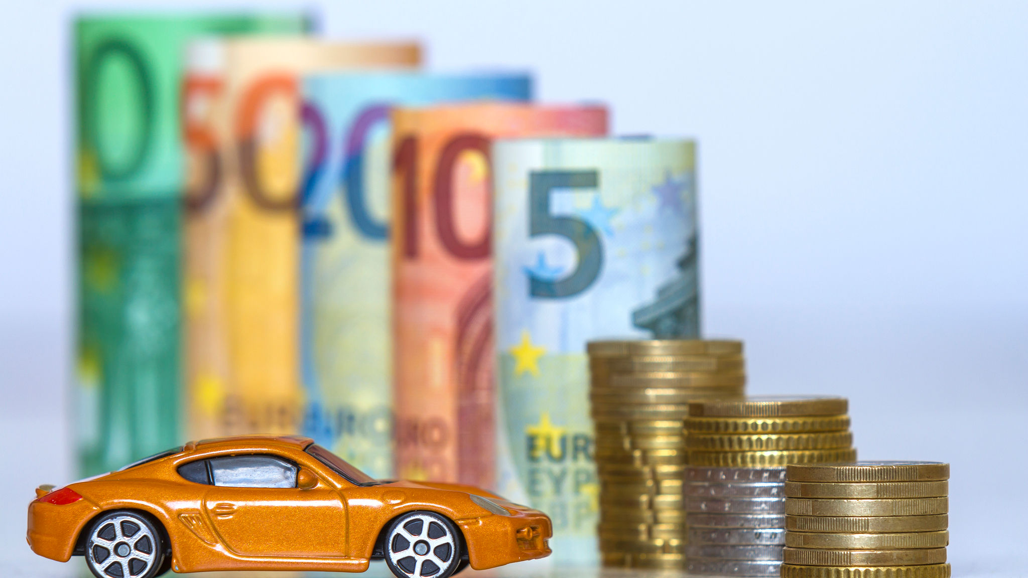 Toy car, currencies and coins 