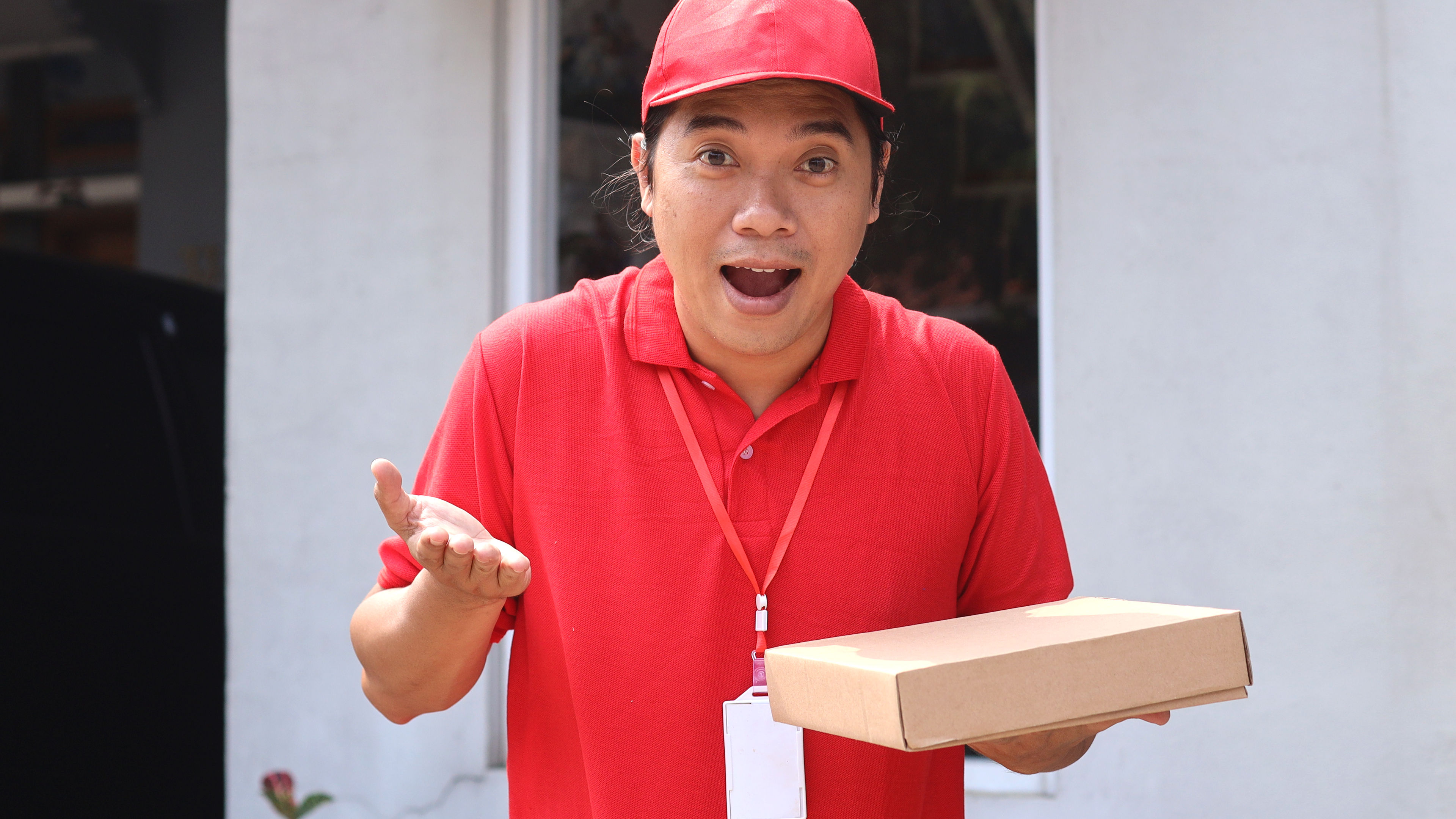 A delivery man with a packed food delivery