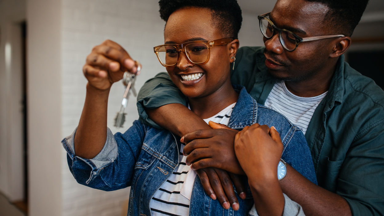 couple-holding-the-keys-of-their-new-house-2022-05-30-23-32-59-utc