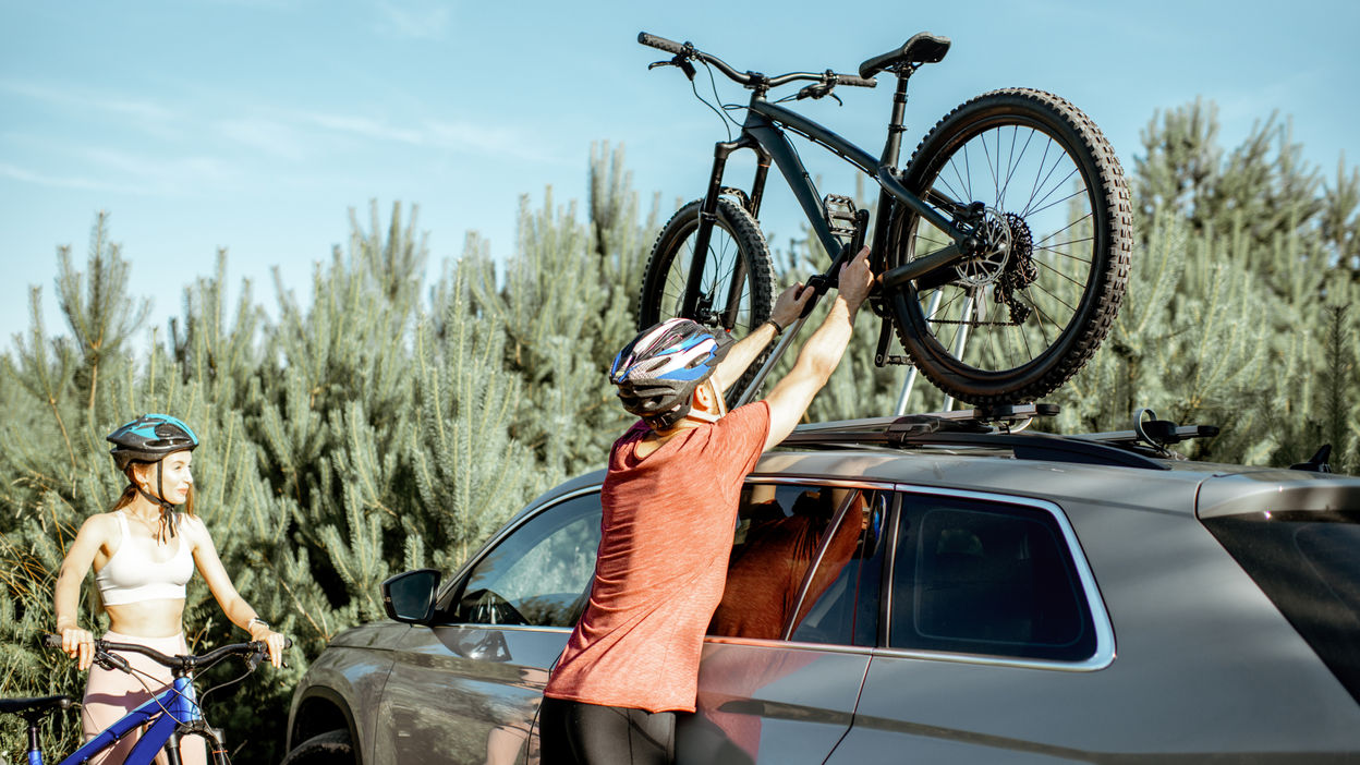 couple-with-bicycles-and-car-in-the-forest-2022-01-18-23-57-42-utc