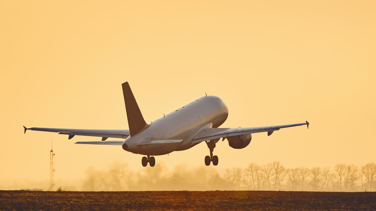 airplane-taking-off-at-sunset-2021-08-26-22-38-54-utc