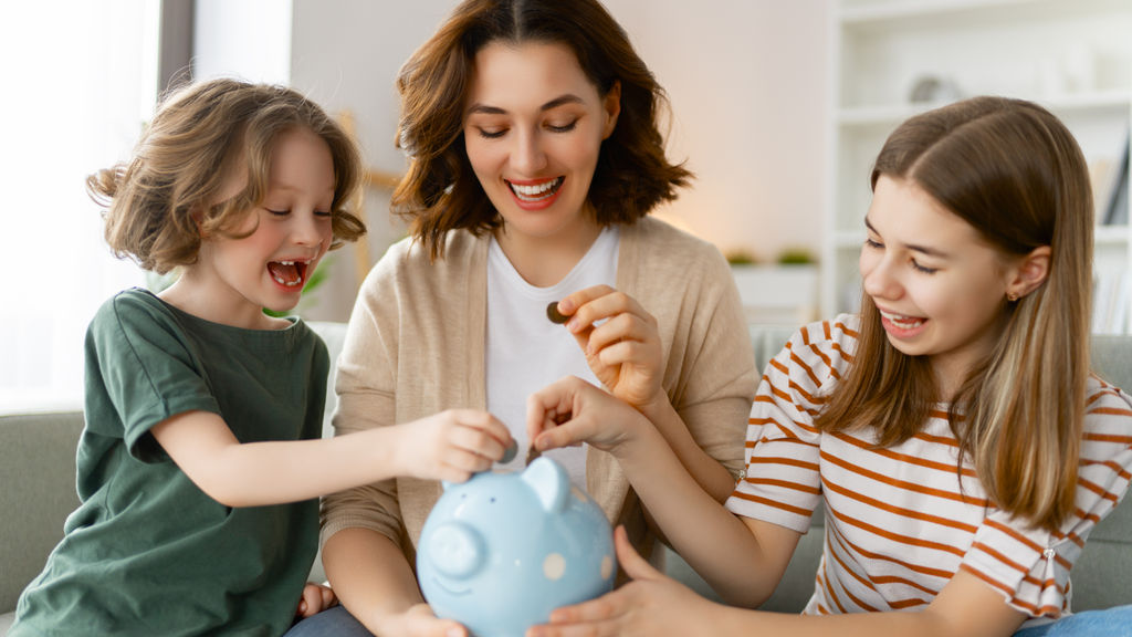 woman-and-children-with-a-piggy-bank-2023-11-27-05-03-50-utc