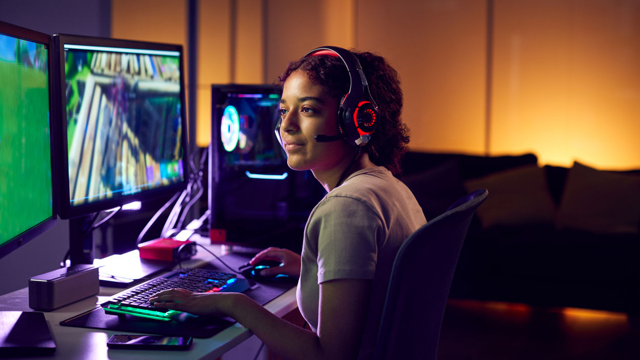 teenage-girl-wearing-headset-gaming-at-home-using-2023-11-27-04-57-52-utc