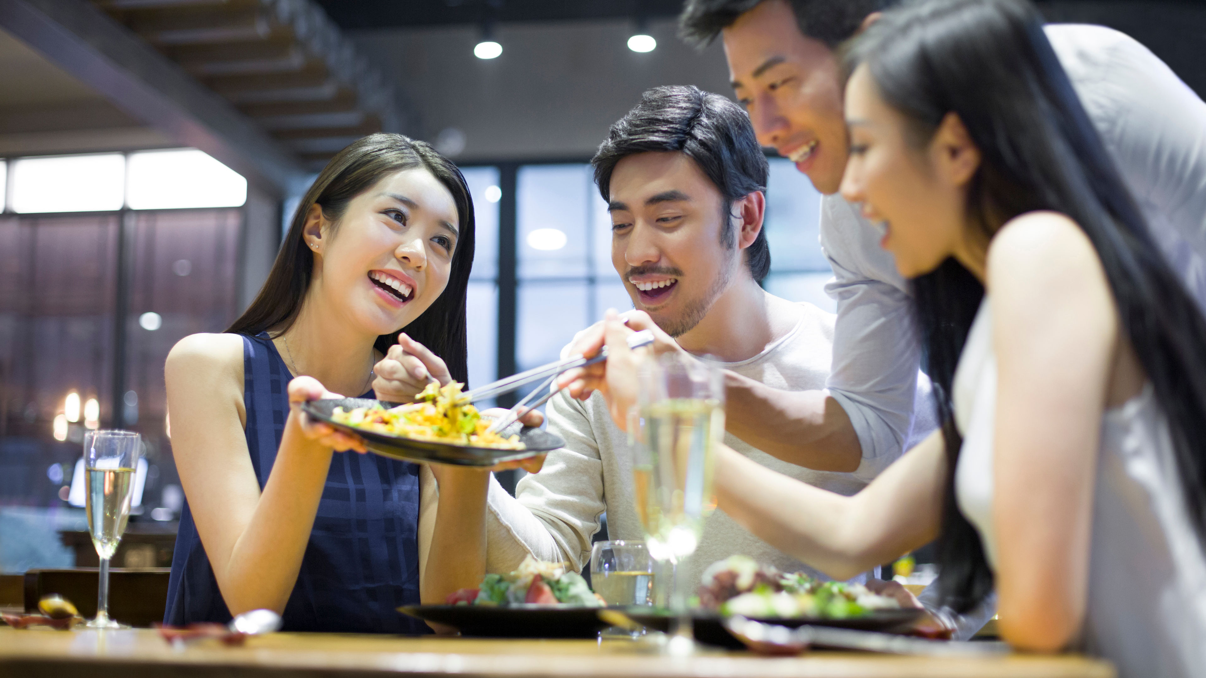 Group of Asian friends with happy face sharing food