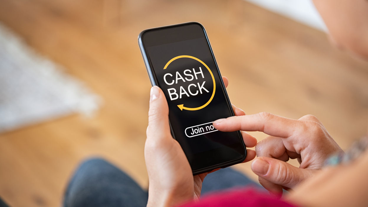 woman-using-cashback-app-on-phone-2021-08-29-23-41-27-utc (1)