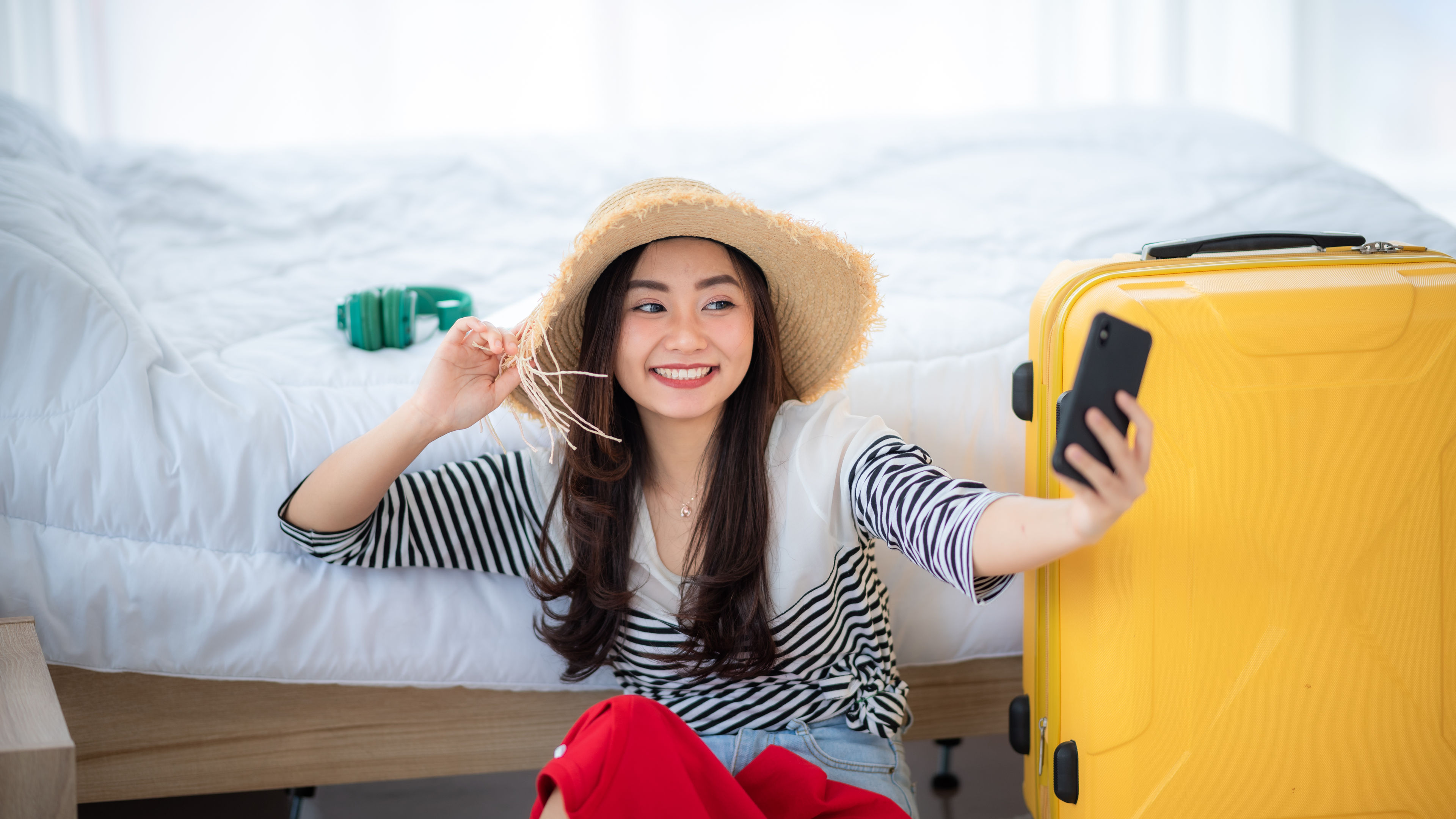 Young asian women with hat taking selfie