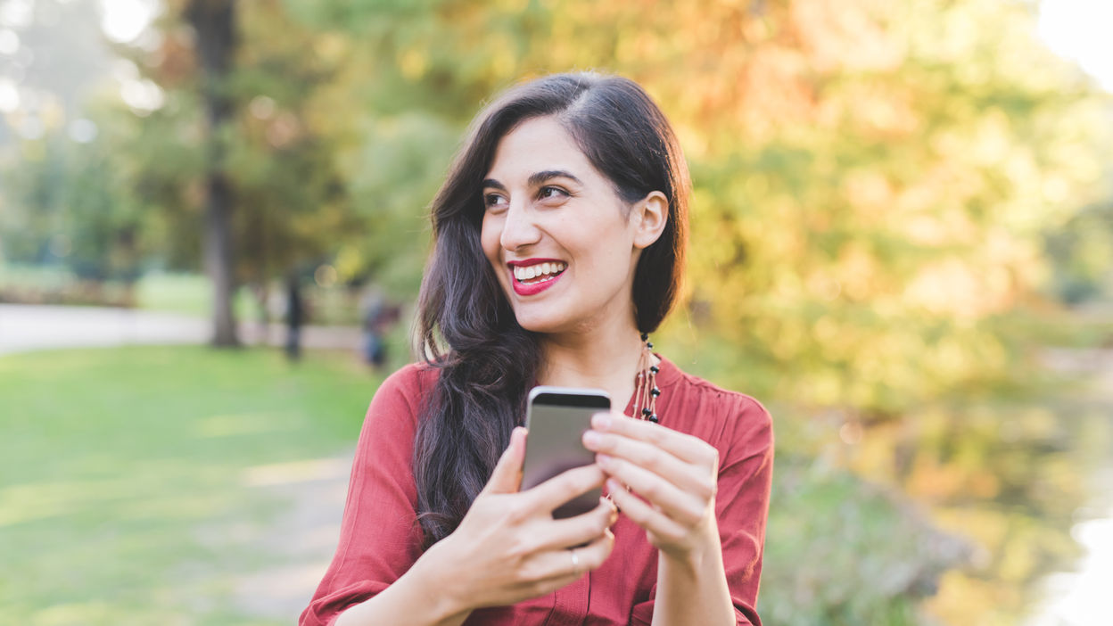 young-woman-outdoor-using-smartphone-2022-01-19-00-59-14-utc