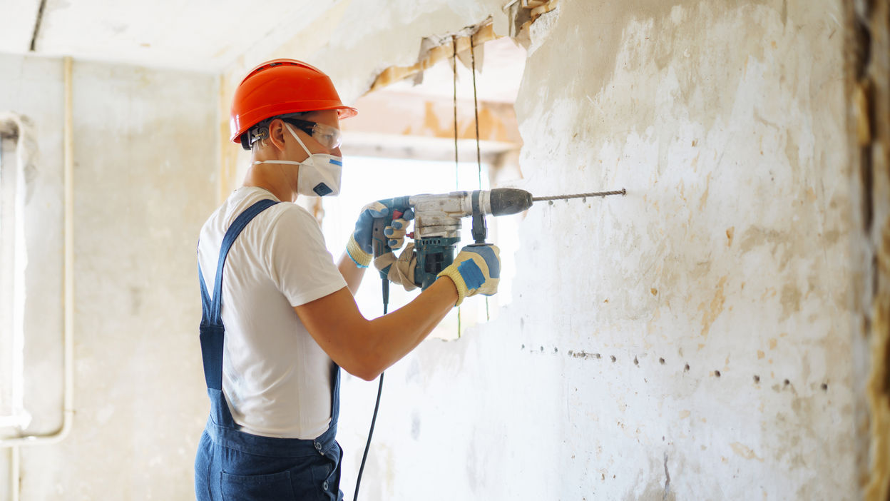 repairer-in-boilersuit-holding-tools-apartment-re-2022-11-09-06-52-48-utc