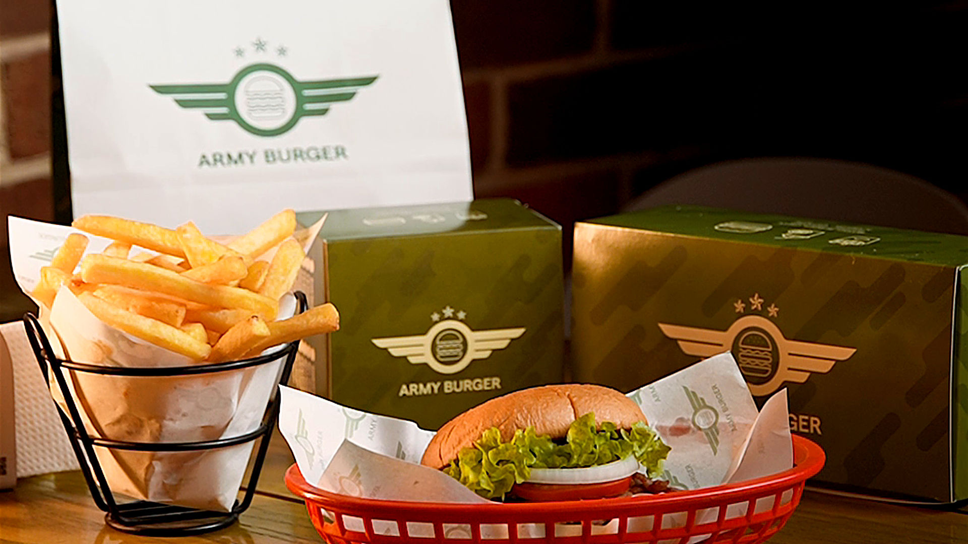 Army Burger branded meal with burger, fries and packaging on a table