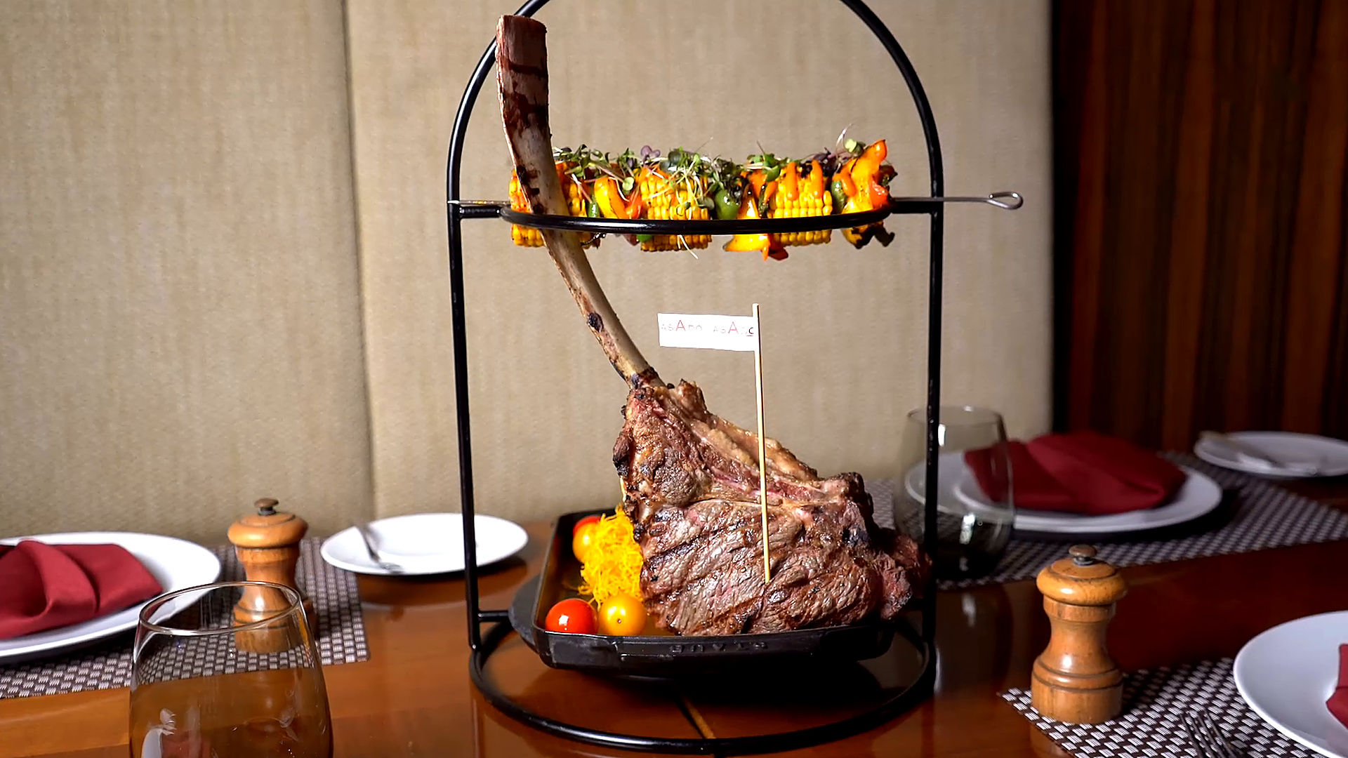 Stacked True North Tomahawk steaks ready for service at Asado Steakhouse