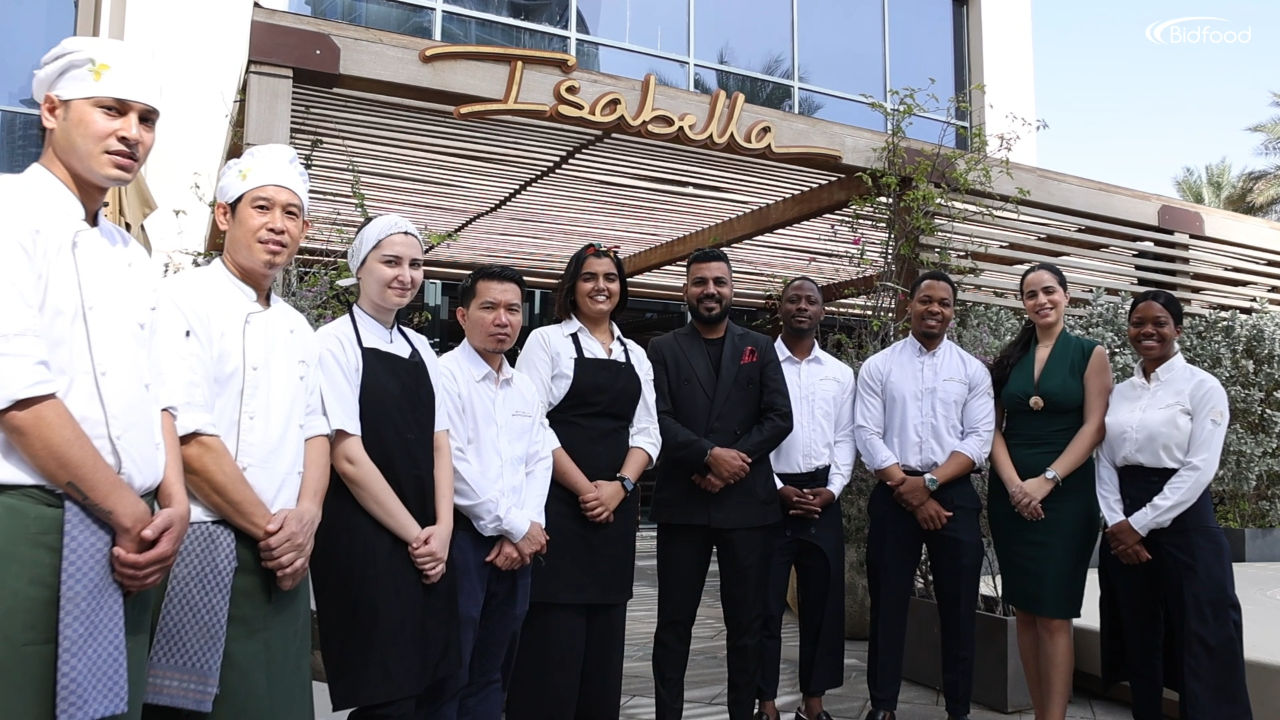 The Isabella Cucina Italiana team gathered outside the restaurant entrance