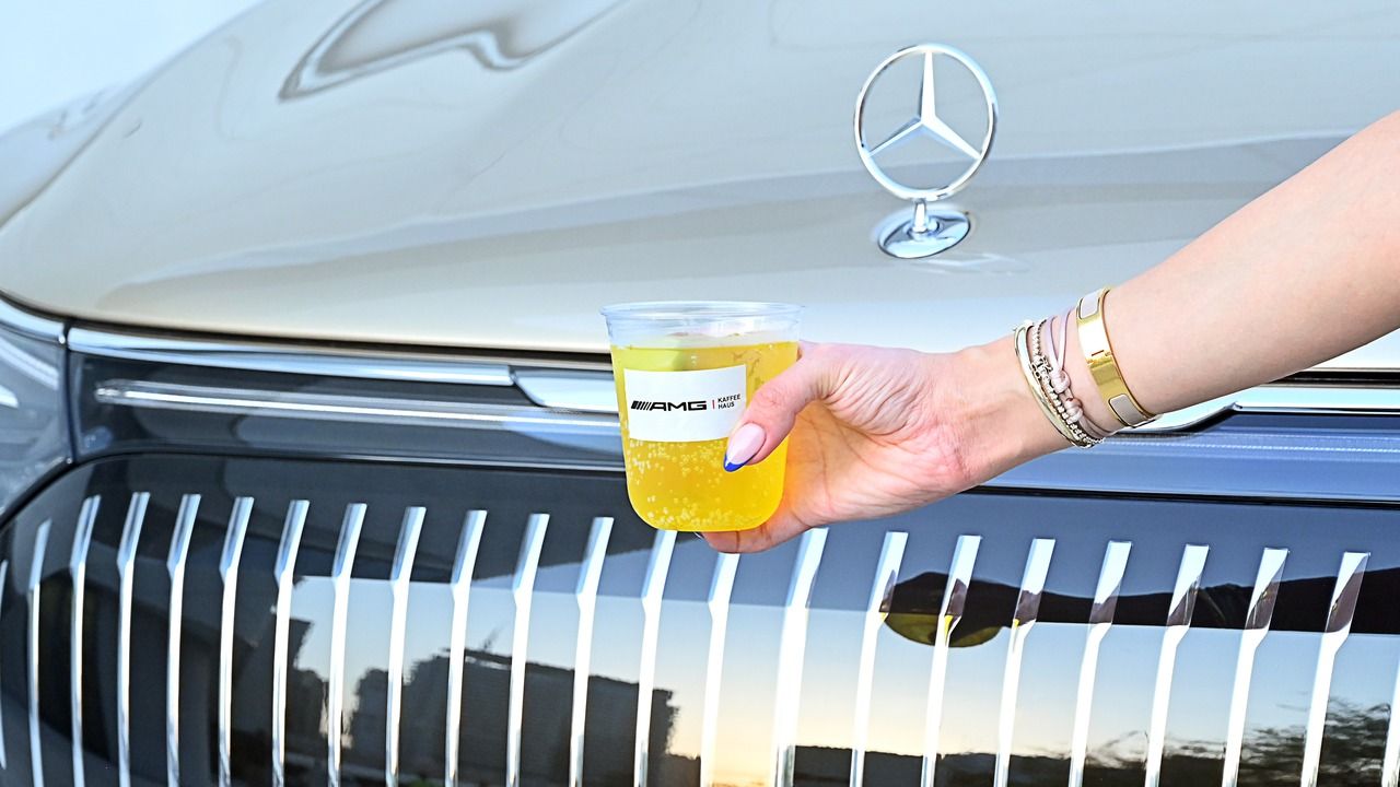 Mocktail cups placed on the hood of a Mercedes-AMG car