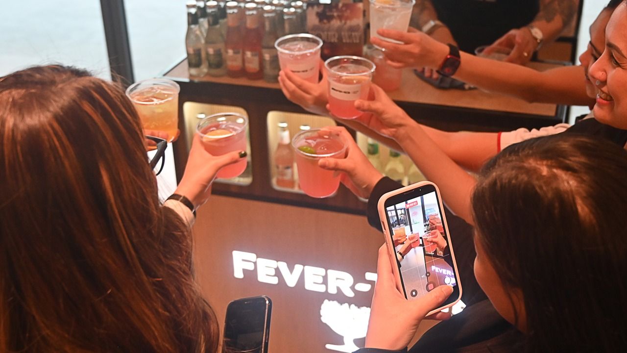 Guests toasting with mocktails at the race day event