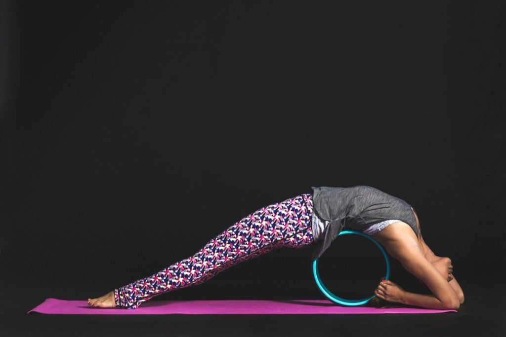 Yoga using a yoga block